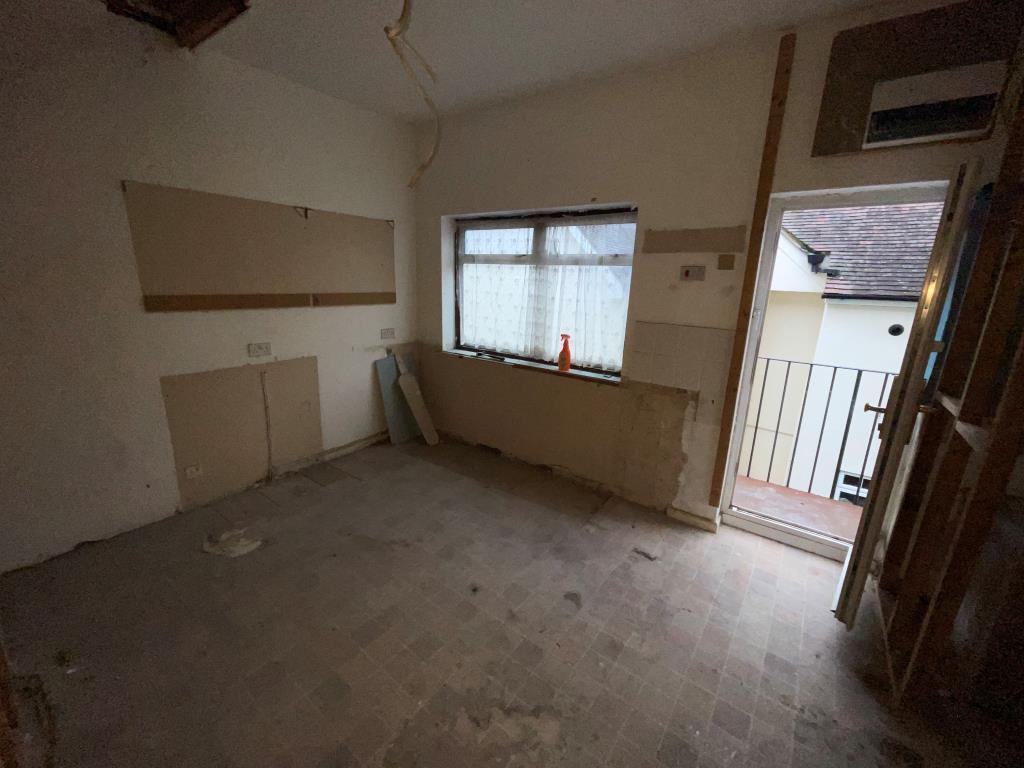 Lot: 57 - FLAT FOR REFURBISHMENT/COMPLETION - Former kitchen stripped back